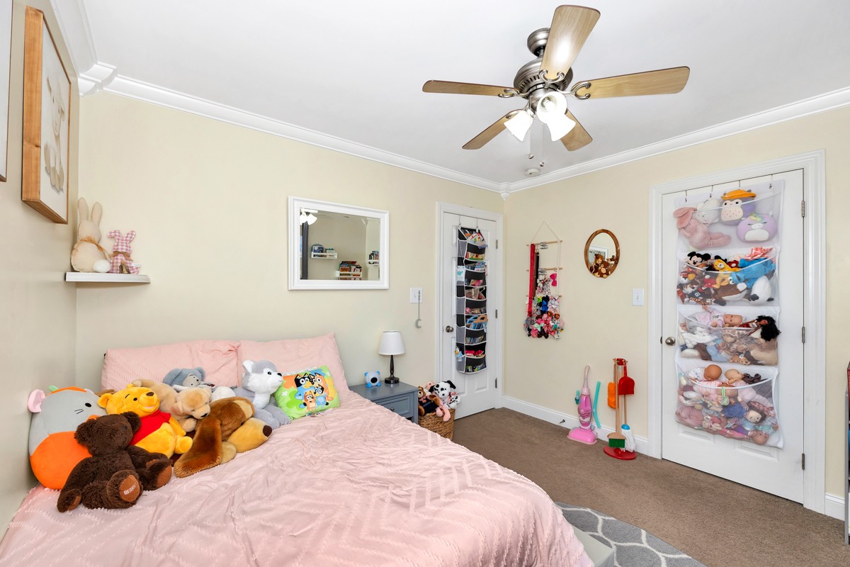 27474 North Wales Road Elkmont, AL 35620 - Photo 15 of 30 a bedroom with a bed and a chandelier