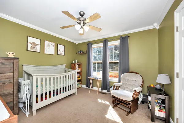 a bedroom with furniture and a window