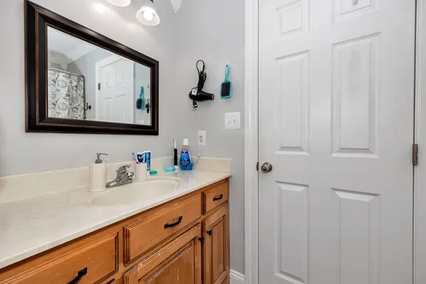 a bathroom with a sink and a mirror