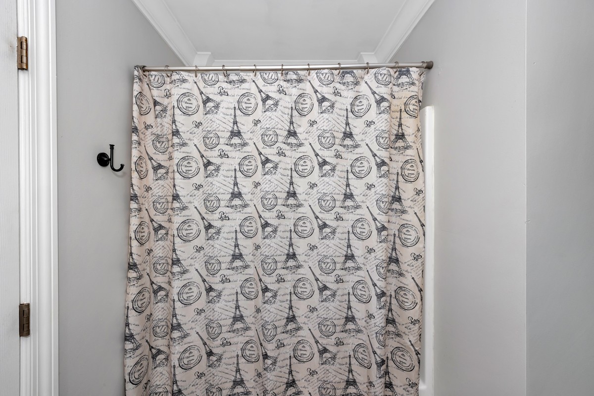 27474 North Wales Road Elkmont, AL 35620 - Photo 23 of 30 a bathroom with a shower curtain