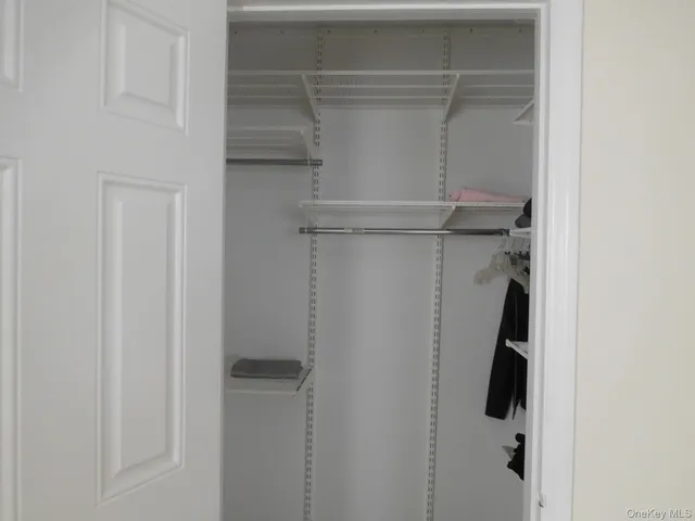 a white toilet sitting next to a shower curtain