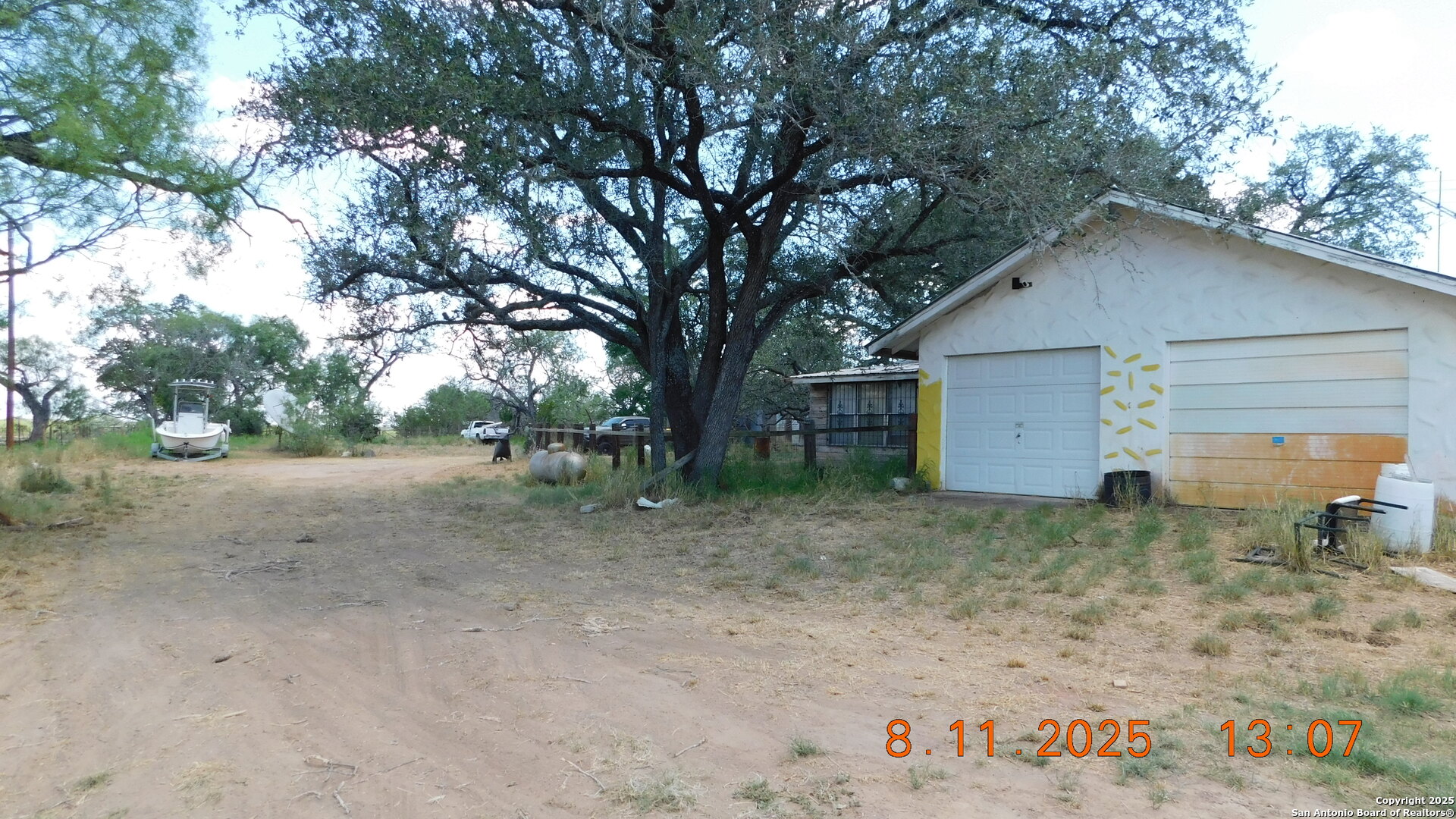 11620 Highway 16 Poteet, TX 78065 - Photo 11 of 38 a view of a house with a yard