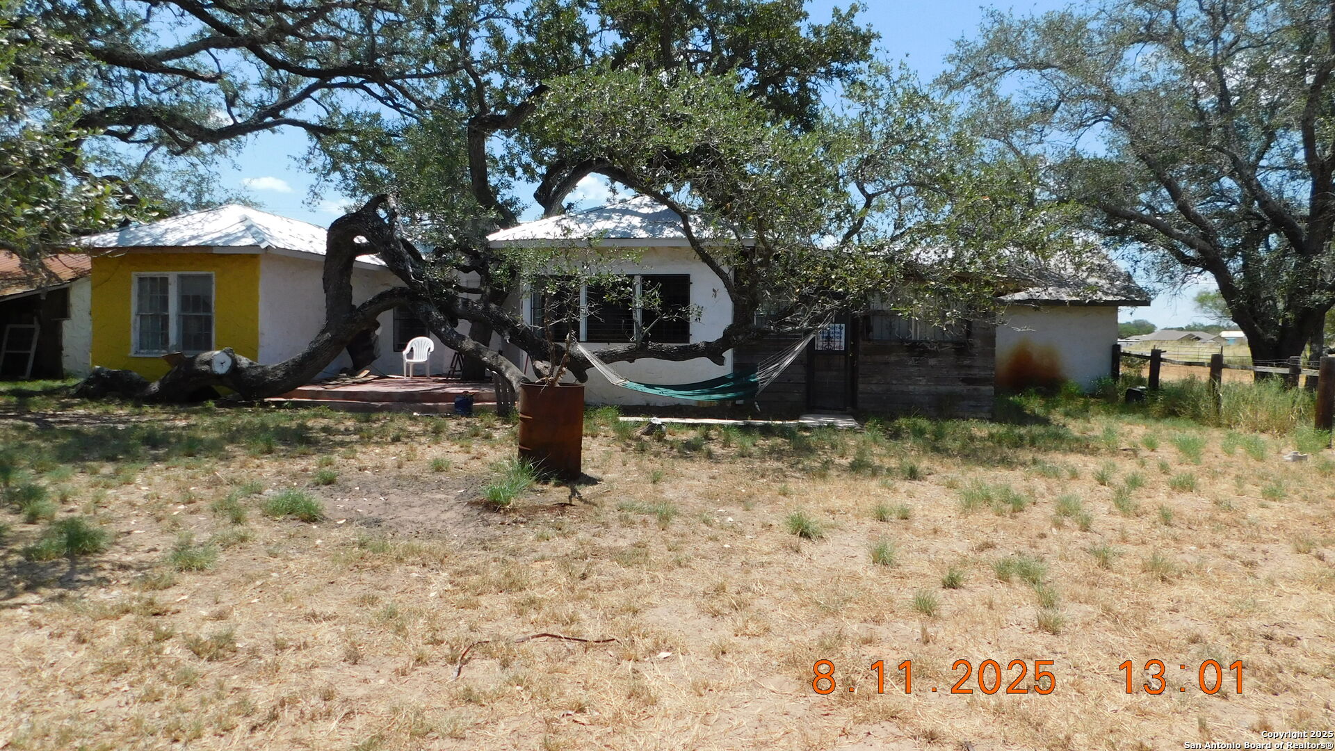11620 Highway 16 Poteet, TX 78065 - Photo 12 of 38 a front view of a house with garden