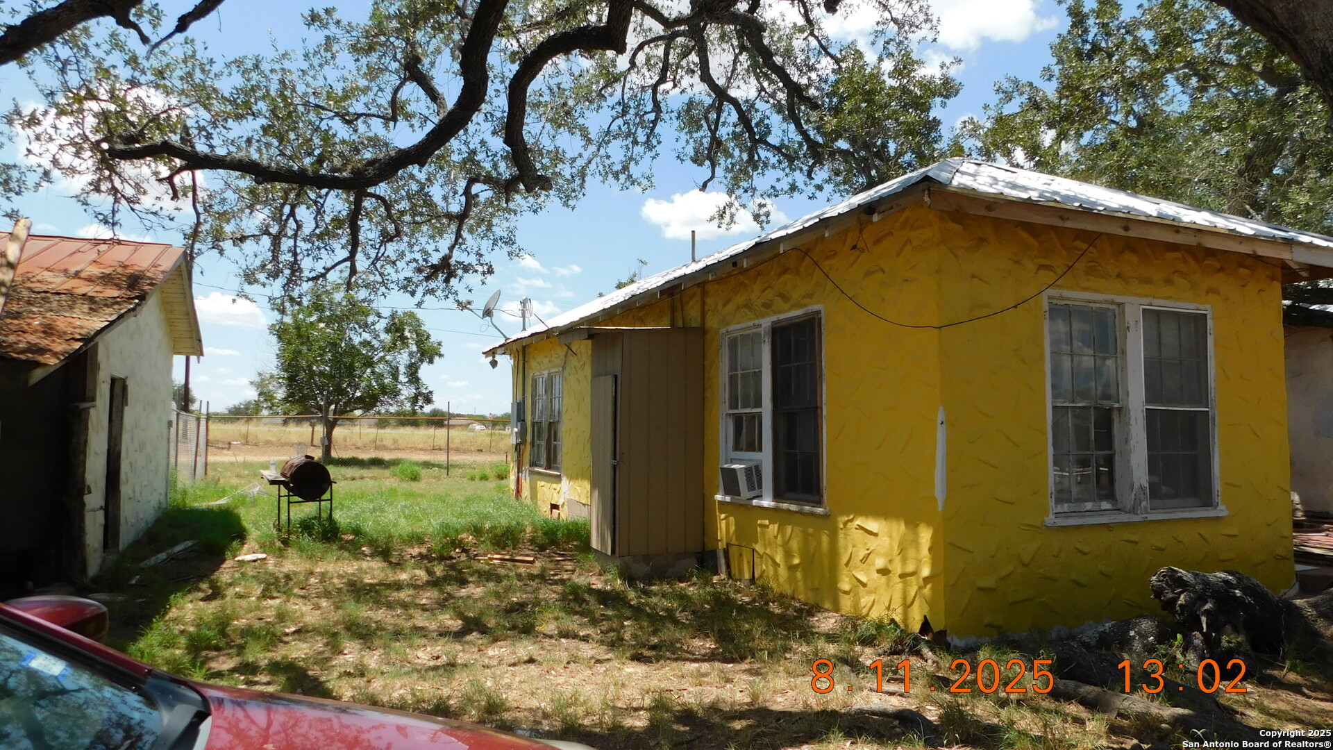 11620 Highway 16 Poteet, TX 78065 - Photo 13 of 38 a view of a house with a yard