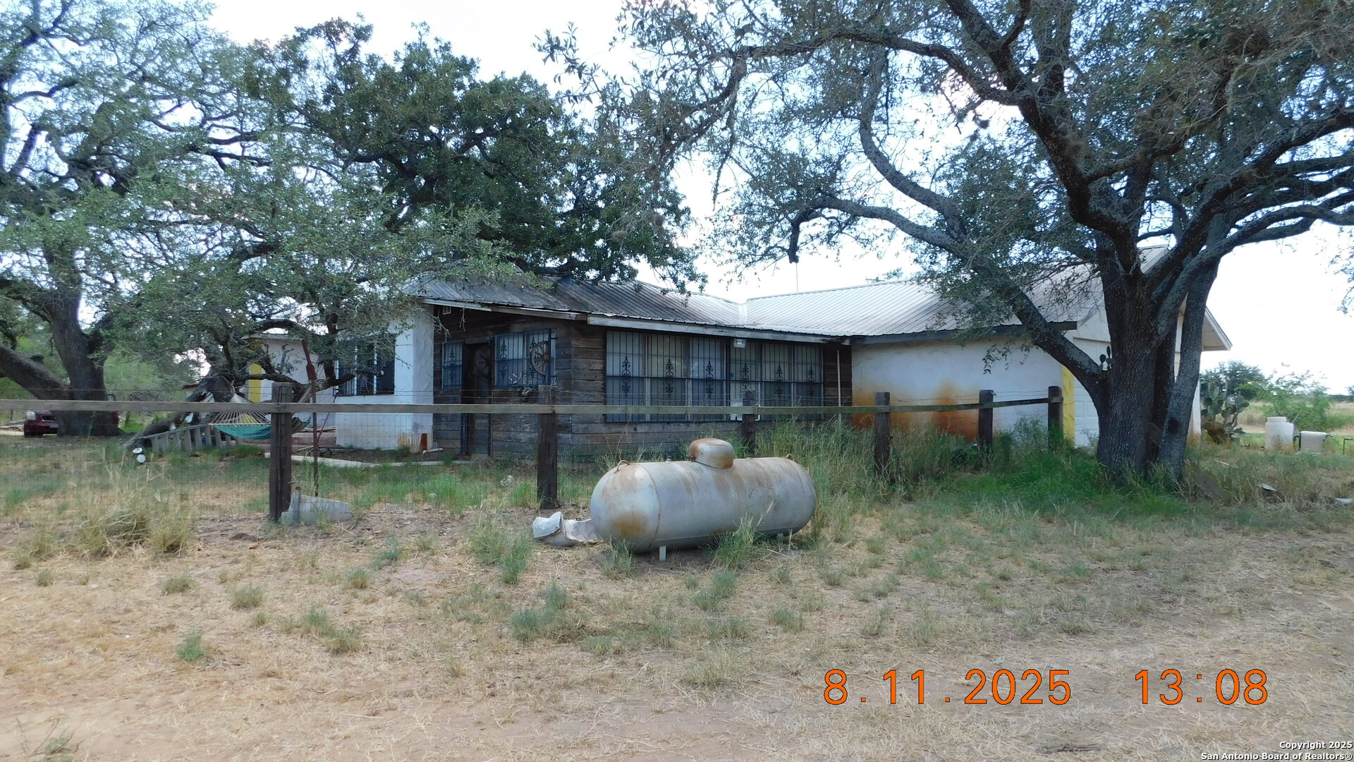 11620 Highway 16 Poteet, TX 78065 - Photo 14 of 38 a backyard of a house with oven and swing