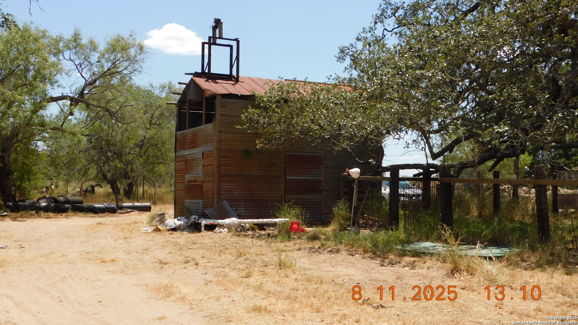 11620 Highway 16 Poteet, TX 78065 - Photo 16 of 38 a backyard of a house with a tree