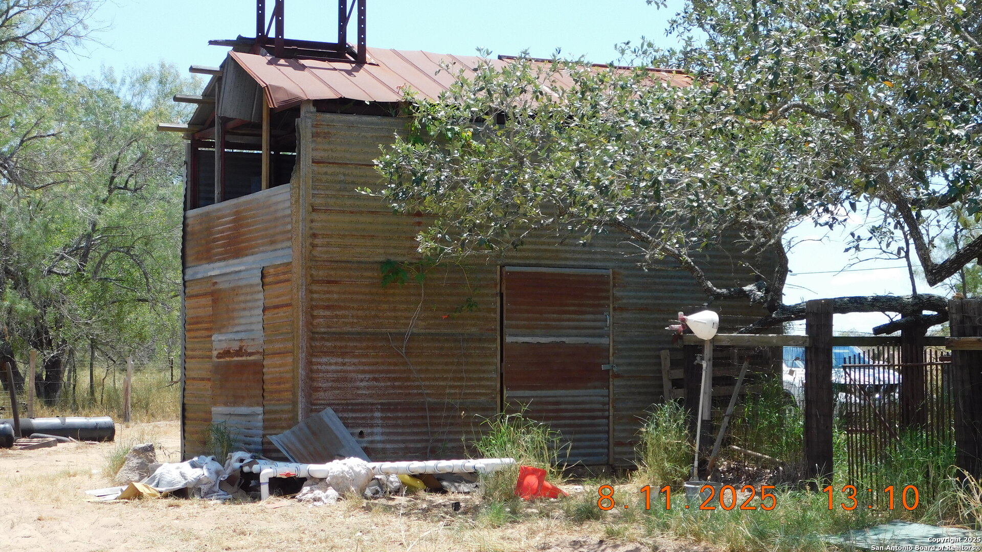 11620 Highway 16 Poteet, TX 78065 - Photo 17 of 38 a backyard of a building with trees