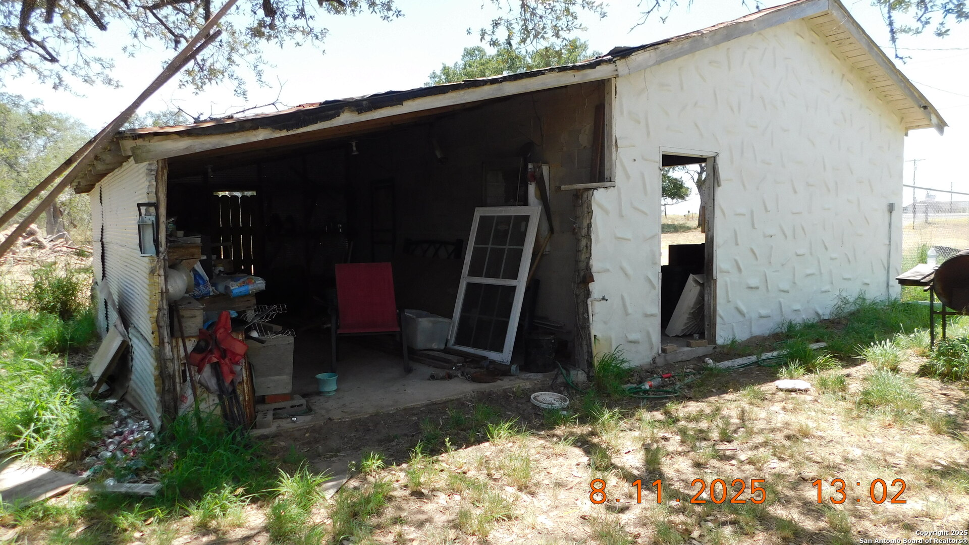11620 Highway 16 Poteet, TX 78065 - Photo 22 of 38 a view of a back yard of the house