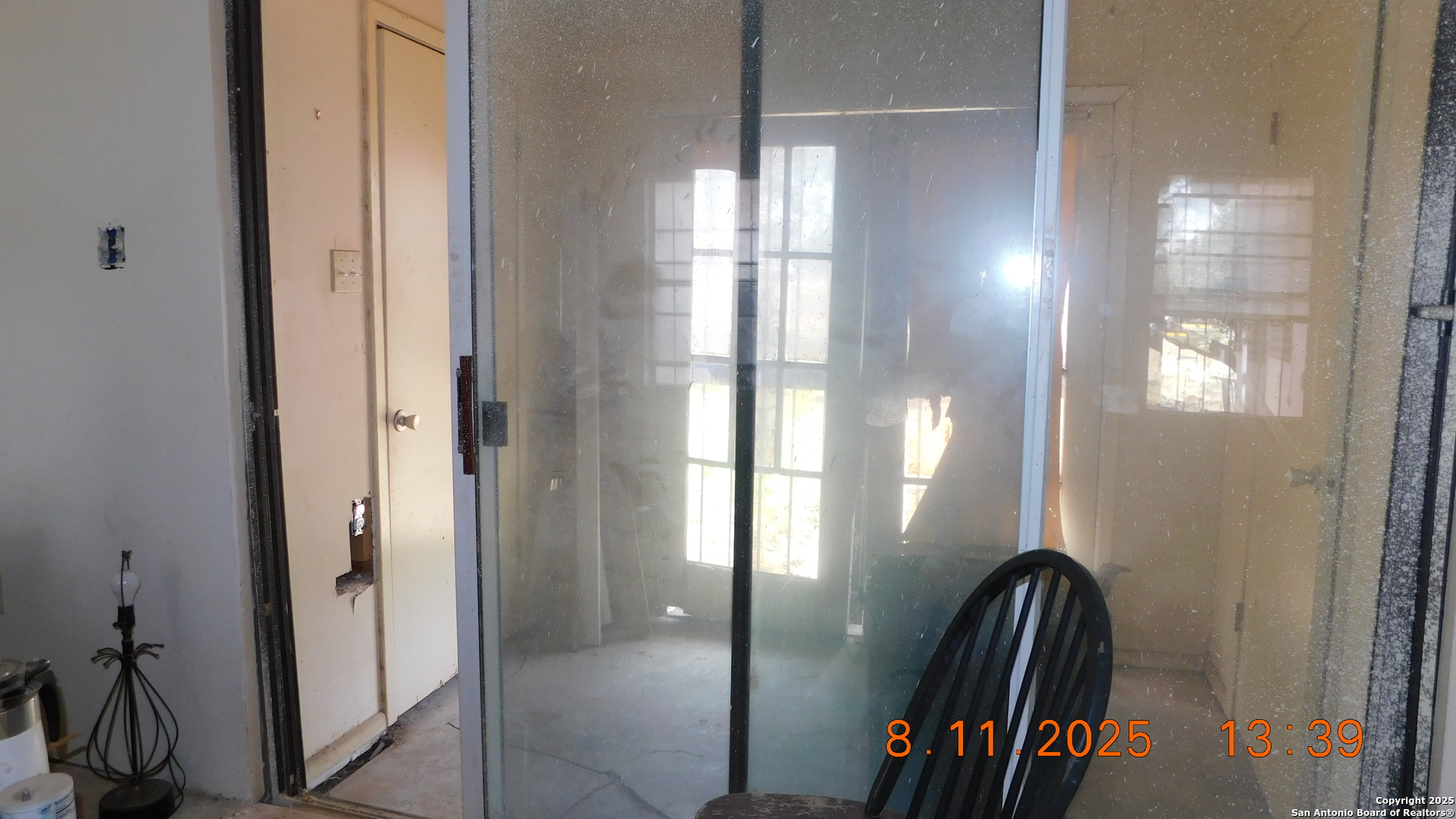 11620 Highway 16 Poteet, TX 78065 - Photo 30 of 38 a view of a hallway with wooden floor and a livingroom view