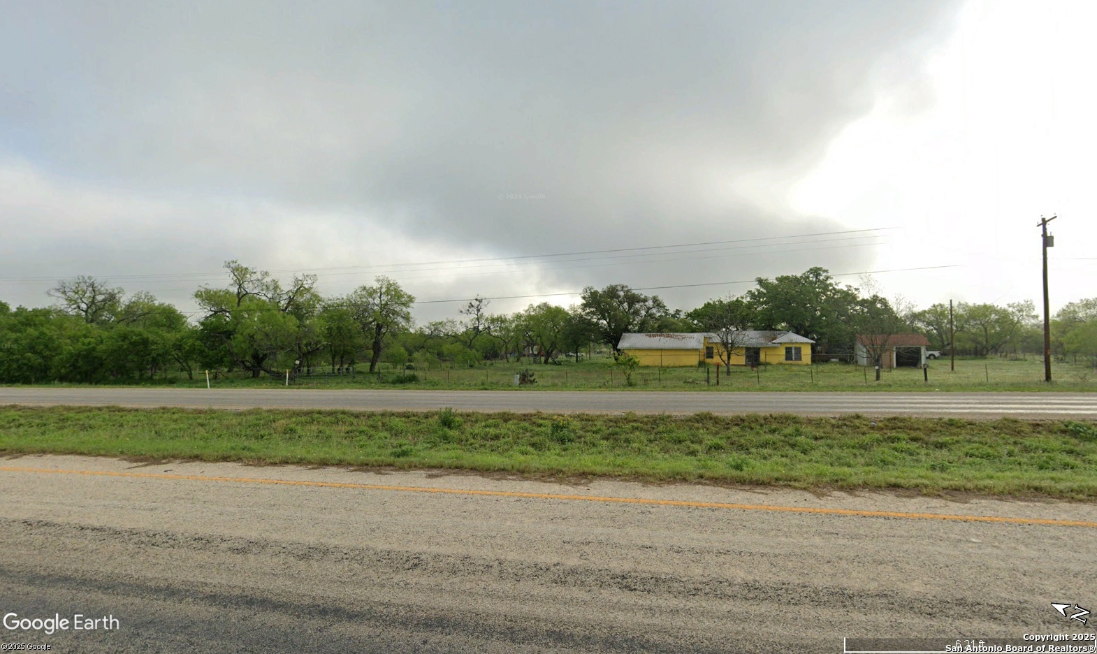 11620 Highway 16 Poteet, TX 78065 - Photo 3 of 38 a view of a grassy field with trees