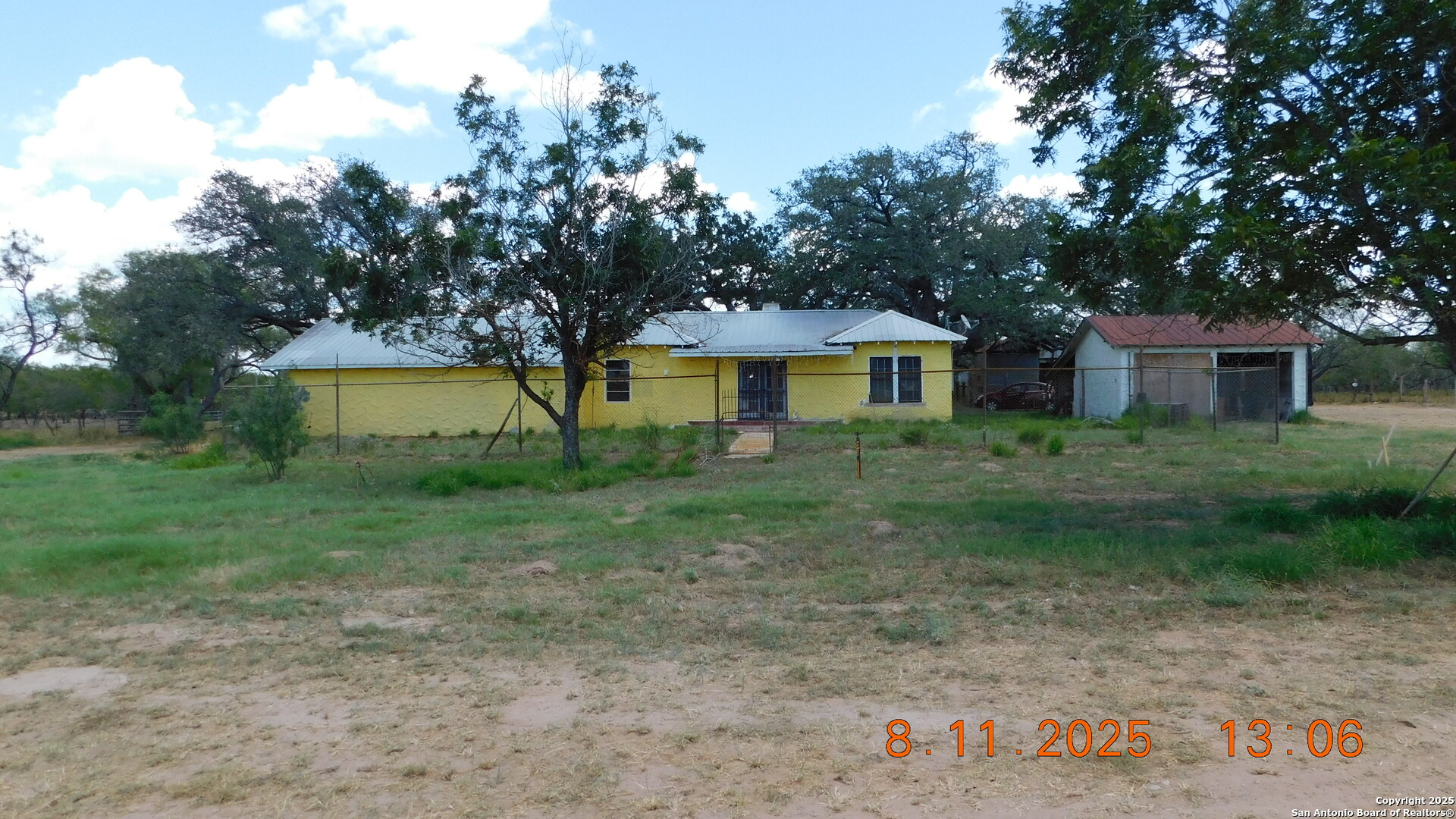 11620 Highway 16 Poteet, TX 78065 - Photo 4 of 38 a view of a house with a yard