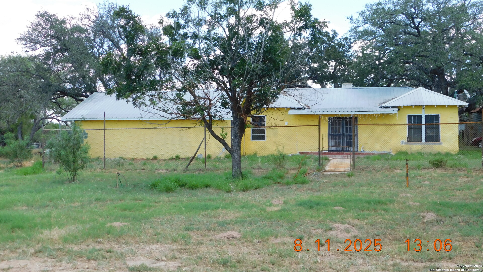 11620 Highway 16 Poteet, TX 78065 - Photo 6 of 38 a view of a house with a yard
