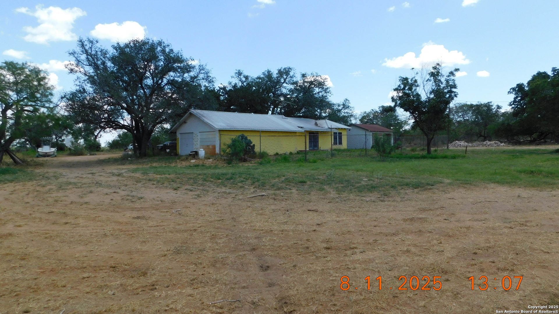 11620 Highway 16 Poteet, TX 78065 - Photo 7 of 38 a view of a house with a yard