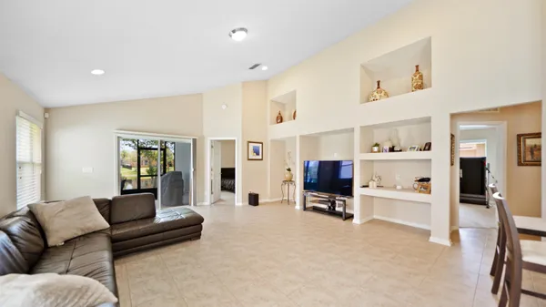 a living room with furniture and gym equipment