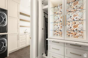 1141 East Lost Ridge Drive Washington, UT 84780 - Photo 44 of 108 Laundry room featuring stacked front-load machines, white cabinetry, wood-finish shelving, and a built-in sink with a gooseneck faucet