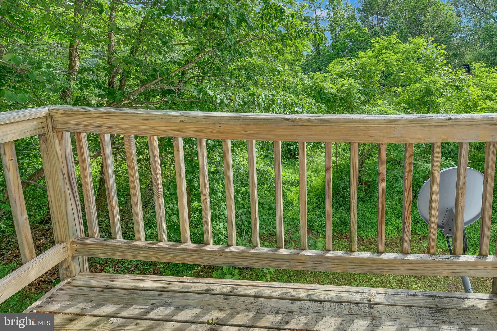 1010 Planters Wharf Road Lusby, MD 20657 - Photo 16 of 26 Deck off master has limited water view w/ foliage