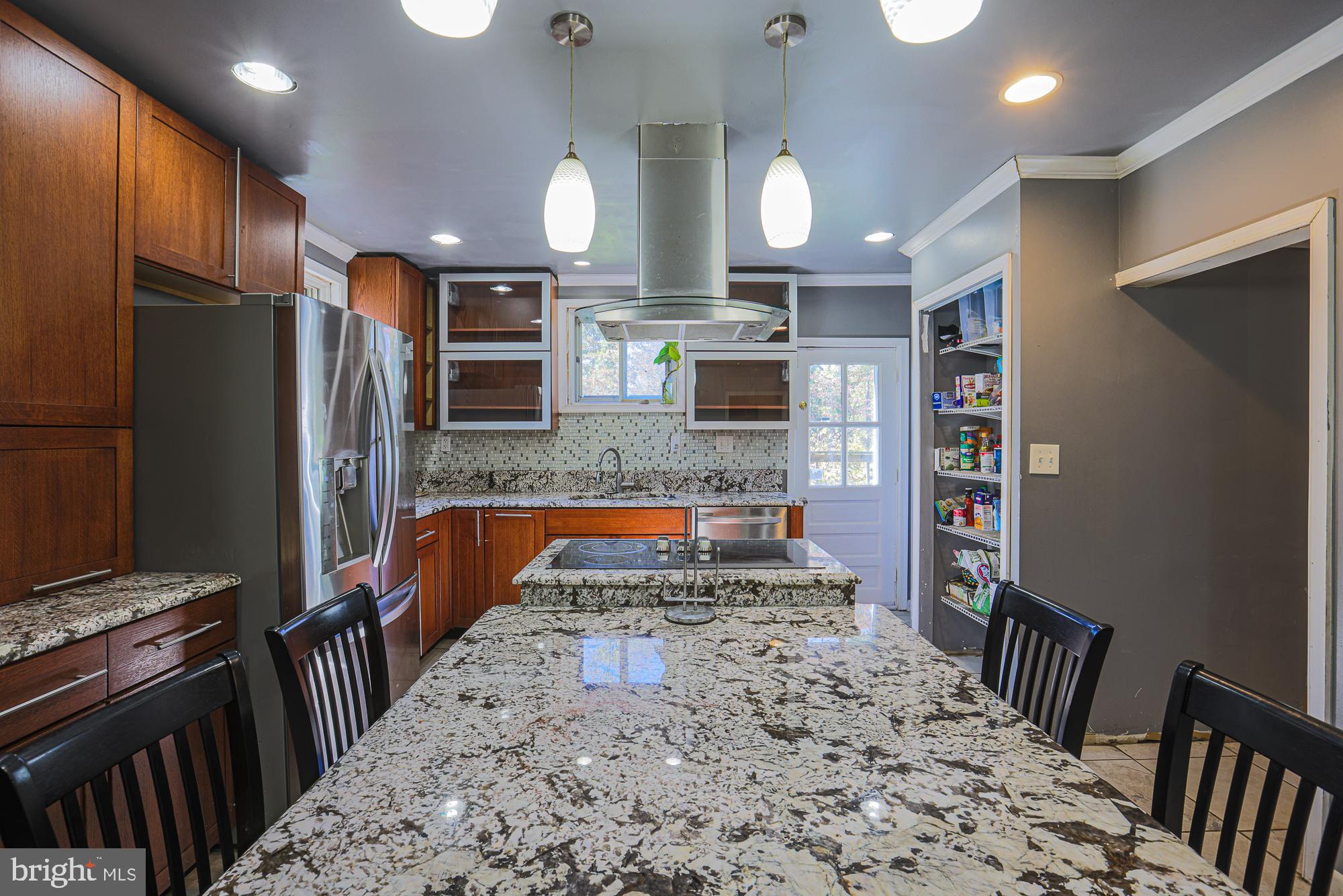 7215 Rockridge Road Baltimore, MD 21207 - Photo 13 of 62 a kitchen with stainless steel appliances granite countertop a refrigerator oven a sink dishwasher and a stove