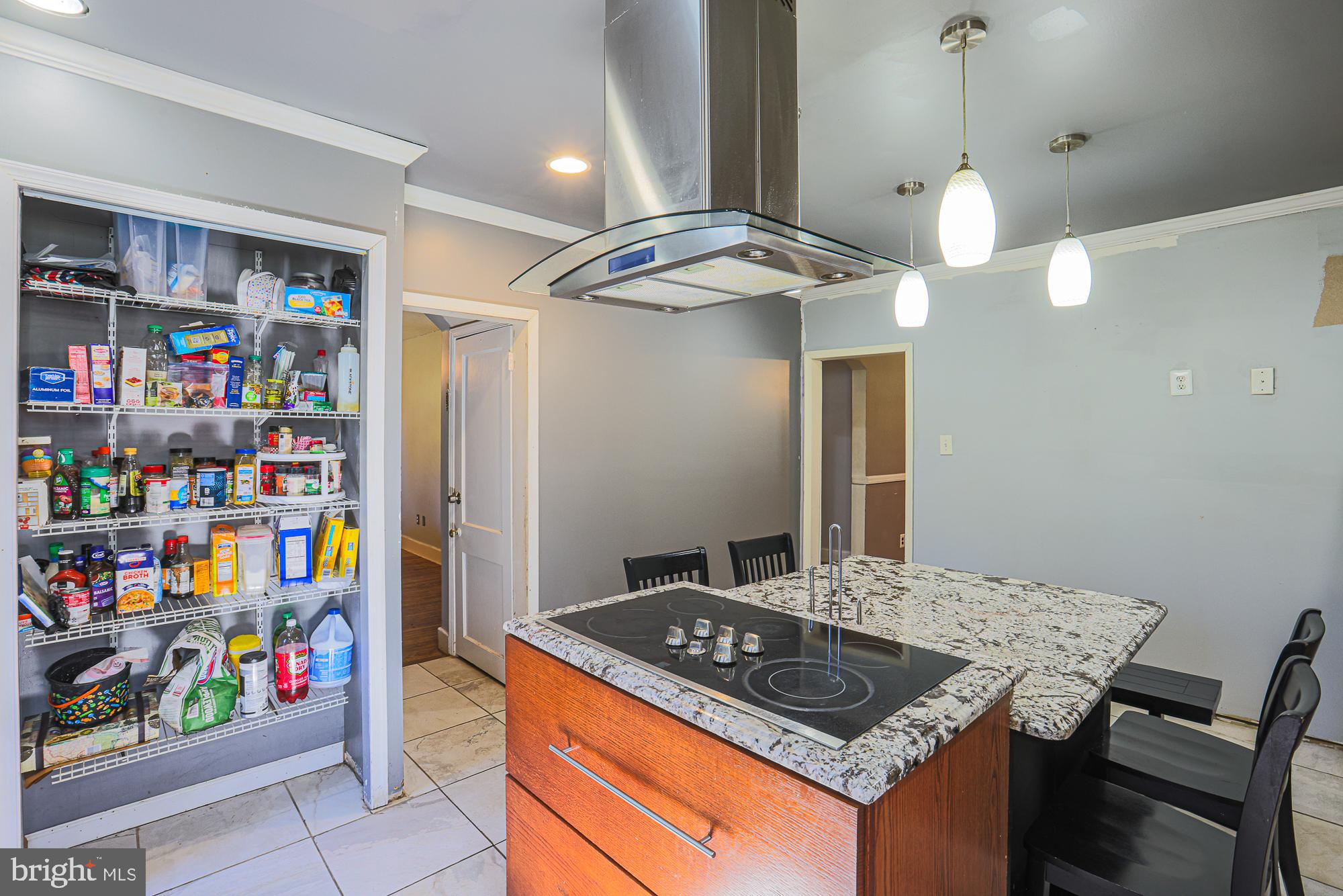 7215 Rockridge Road Baltimore, MD 21207 - Photo 16 of 62 a kitchen with stainless steel appliances granite countertop a sink and a refrigerator