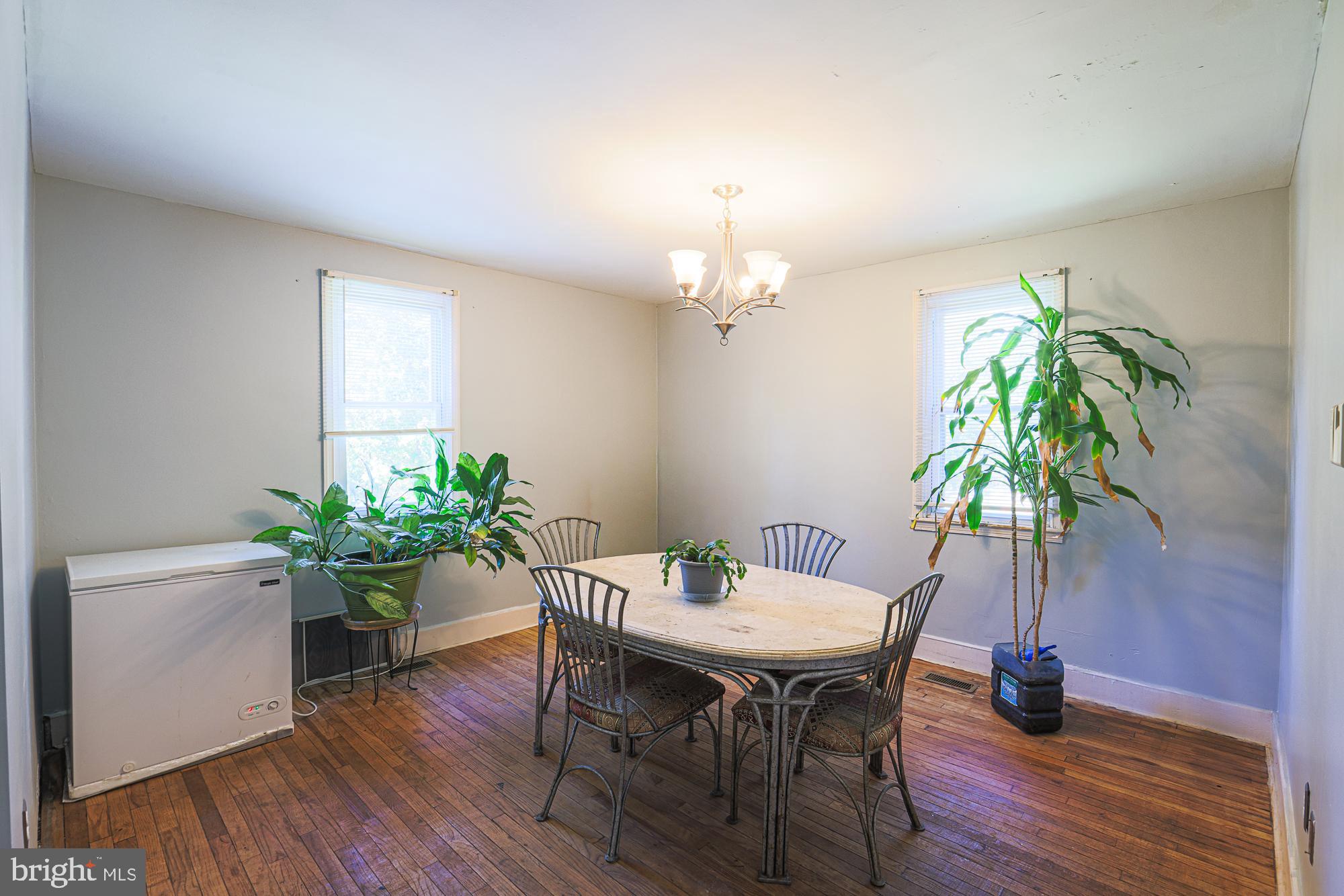 7215 Rockridge Road Baltimore, MD 21207 - Photo 22 of 62 a view of a dining room with furniture and wooden floor