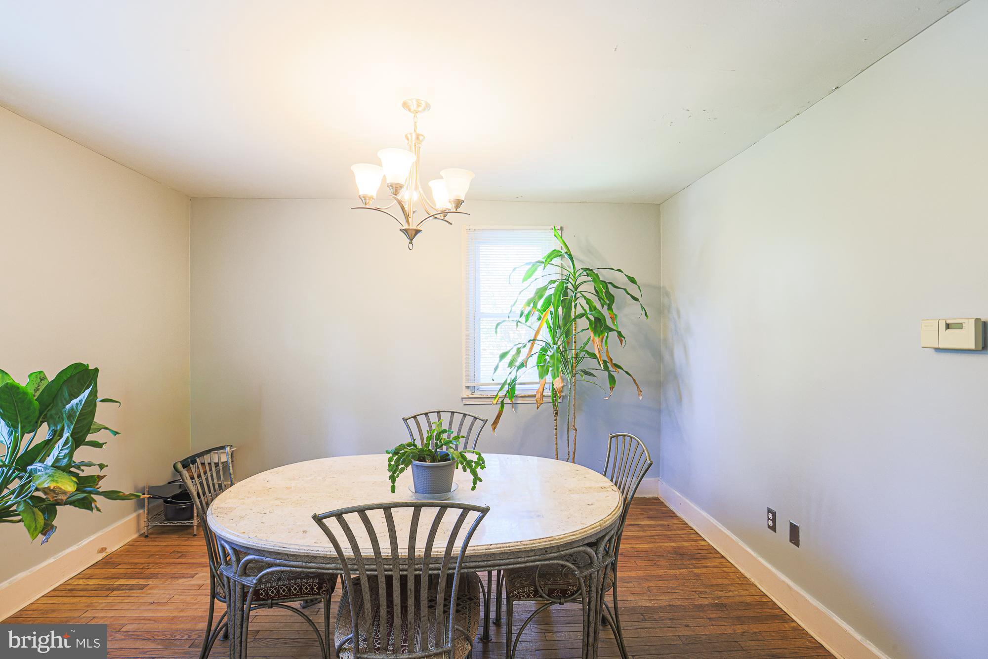 7215 Rockridge Road Baltimore, MD 21207 - Photo 23 of 62 a view of a dining room with furniture and wooden floor