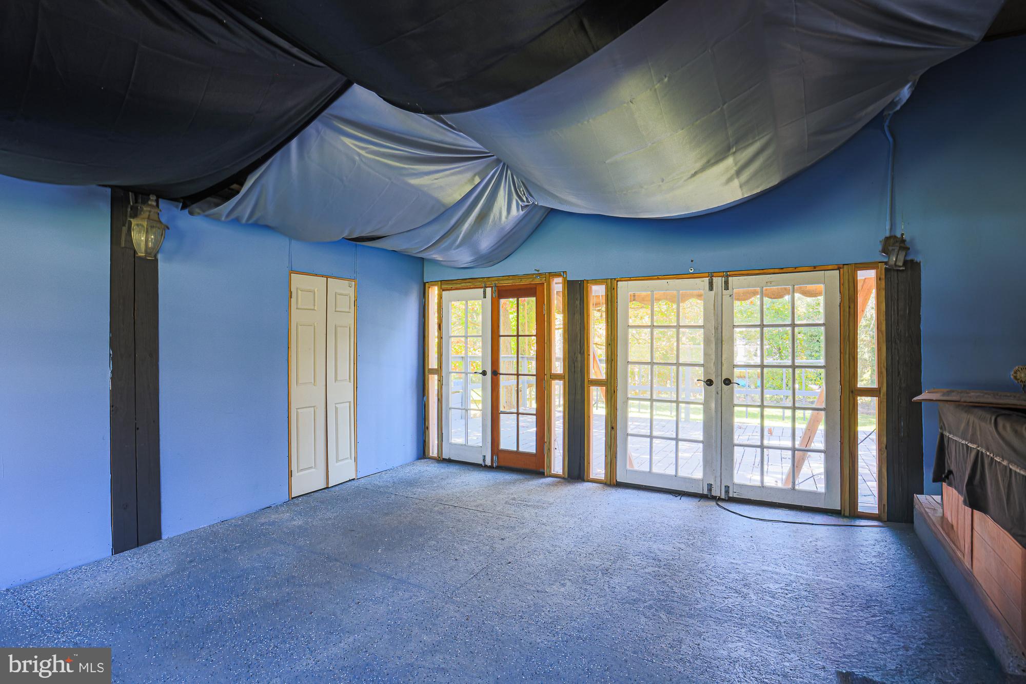 7215 Rockridge Road Baltimore, MD 21207 - Photo 28 of 62 a view of an empty room with a fireplace and a window