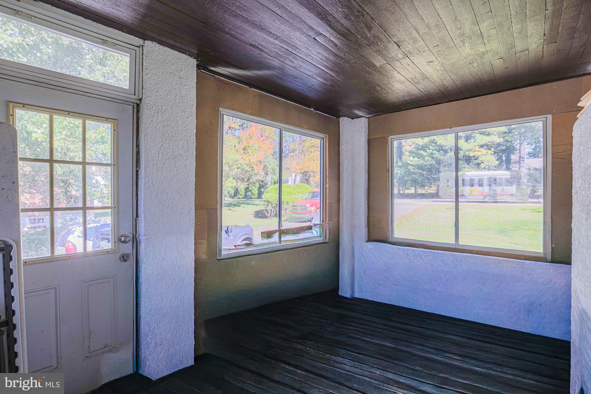 7215 Rockridge Road Baltimore, MD 21207 - Photo 35 of 62 a view of an empty room with wooden floor and a window