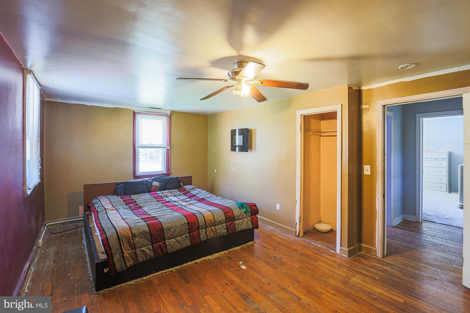 7215 Rockridge Road Baltimore, MD 21207 - Photo 43 of 62 a bedroom with a bed and a chandelier