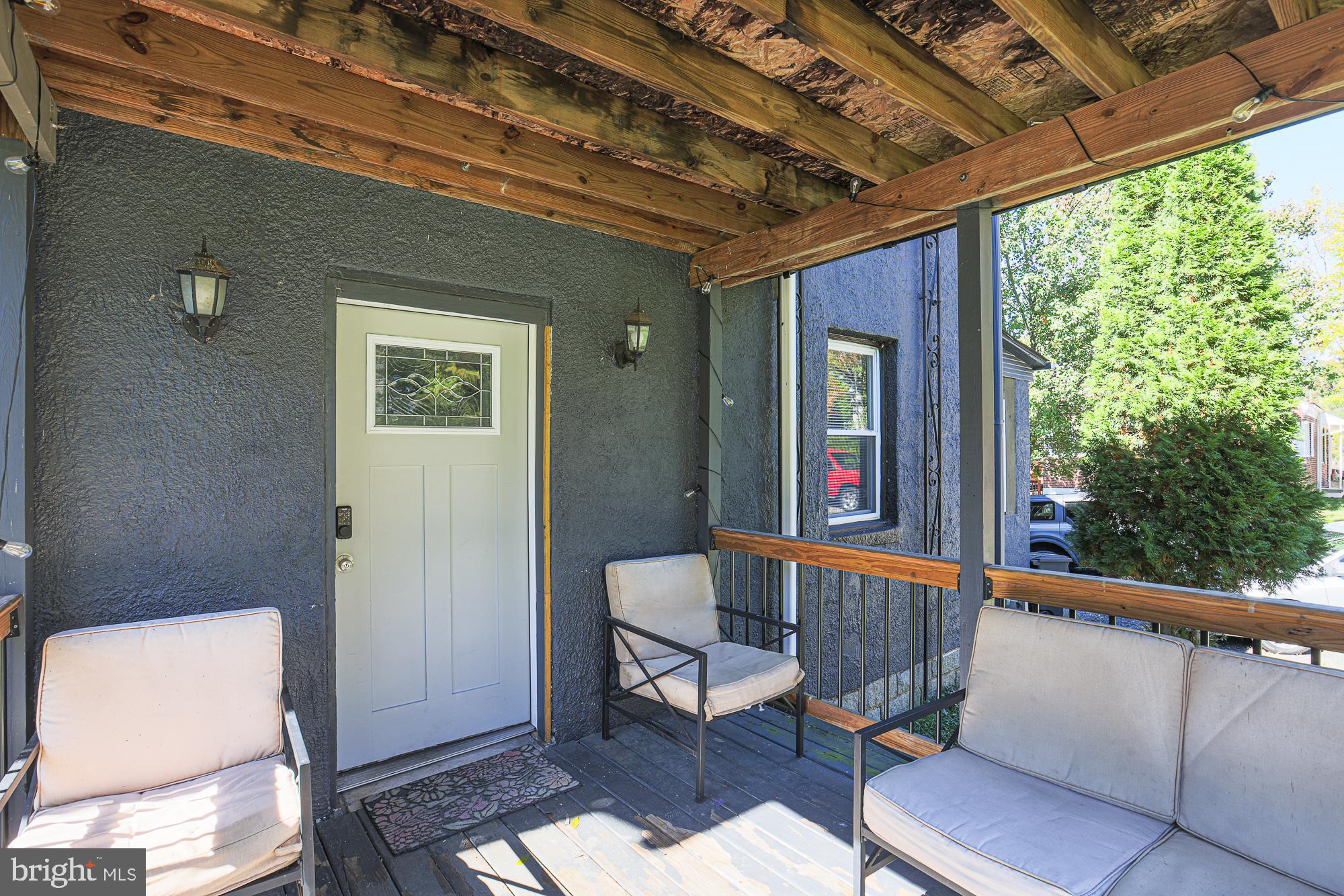 7215 Rockridge Road Baltimore, MD 21207 - Photo 7 of 62 a view of a porch with furniture and a gate