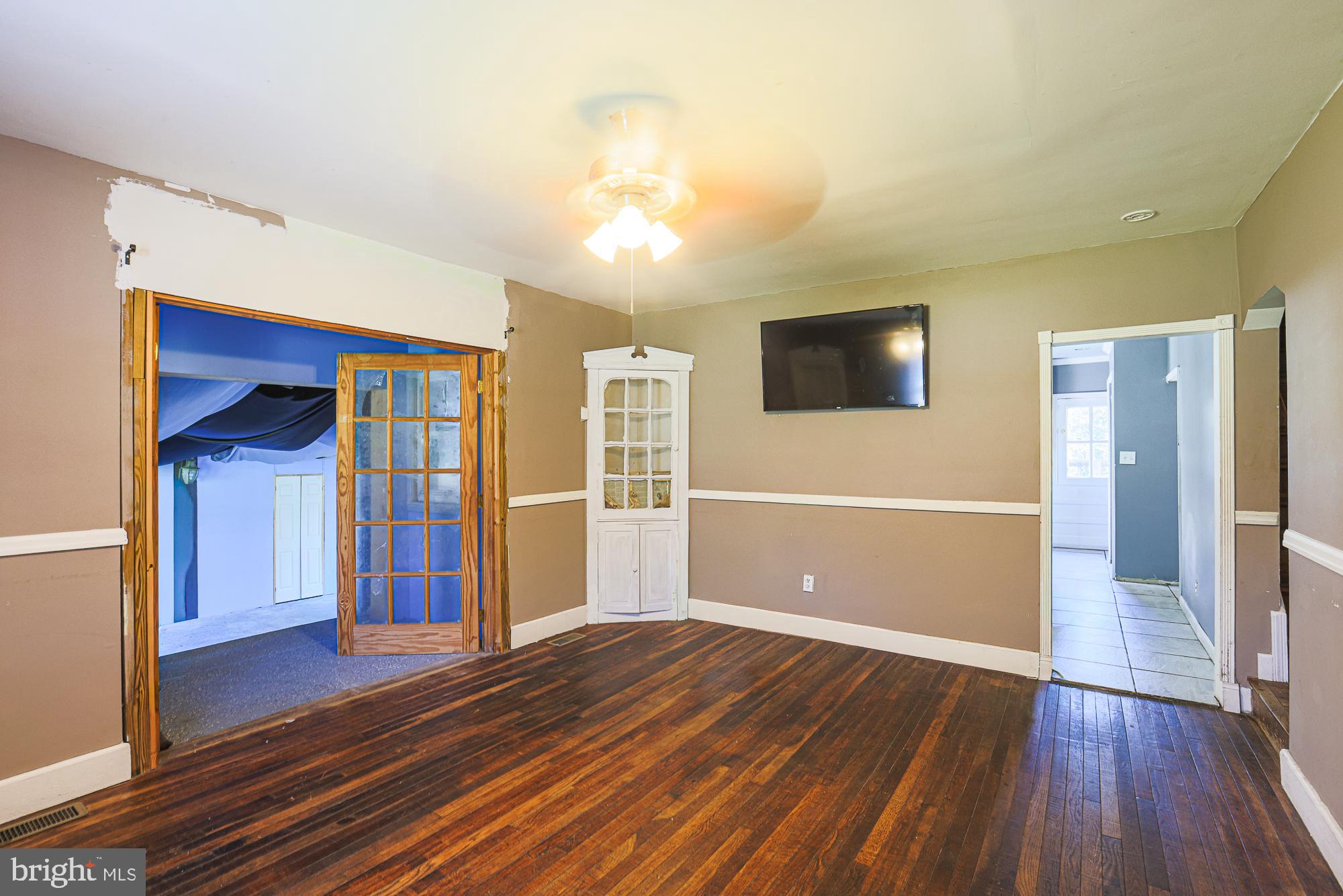 7215 Rockridge Road Baltimore, MD 21207 - Photo 8 of 62 a view of a livingroom with wooden floor and closet