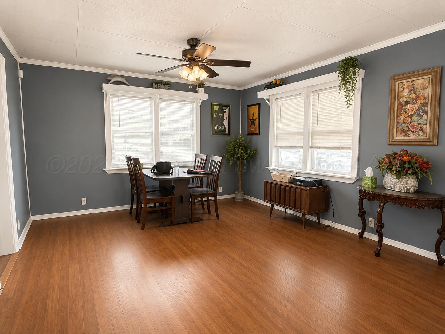 606 South Prospect Street Amarillo, TX 79106 - Photo 11 of 22 a workspace with wooden floor and furniture