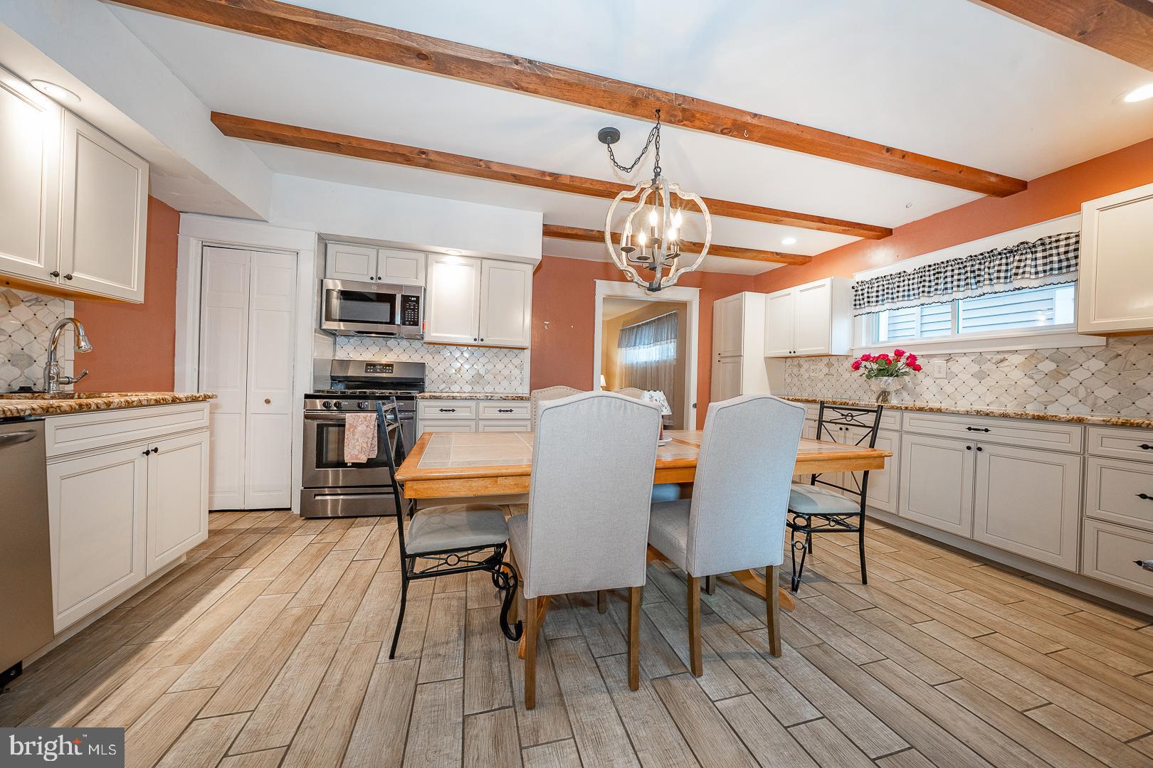 119 Wilson Avenue Havertown, PA 19083 - Photo 17 of 31 a view of kitchen with cabinets and wooden floor