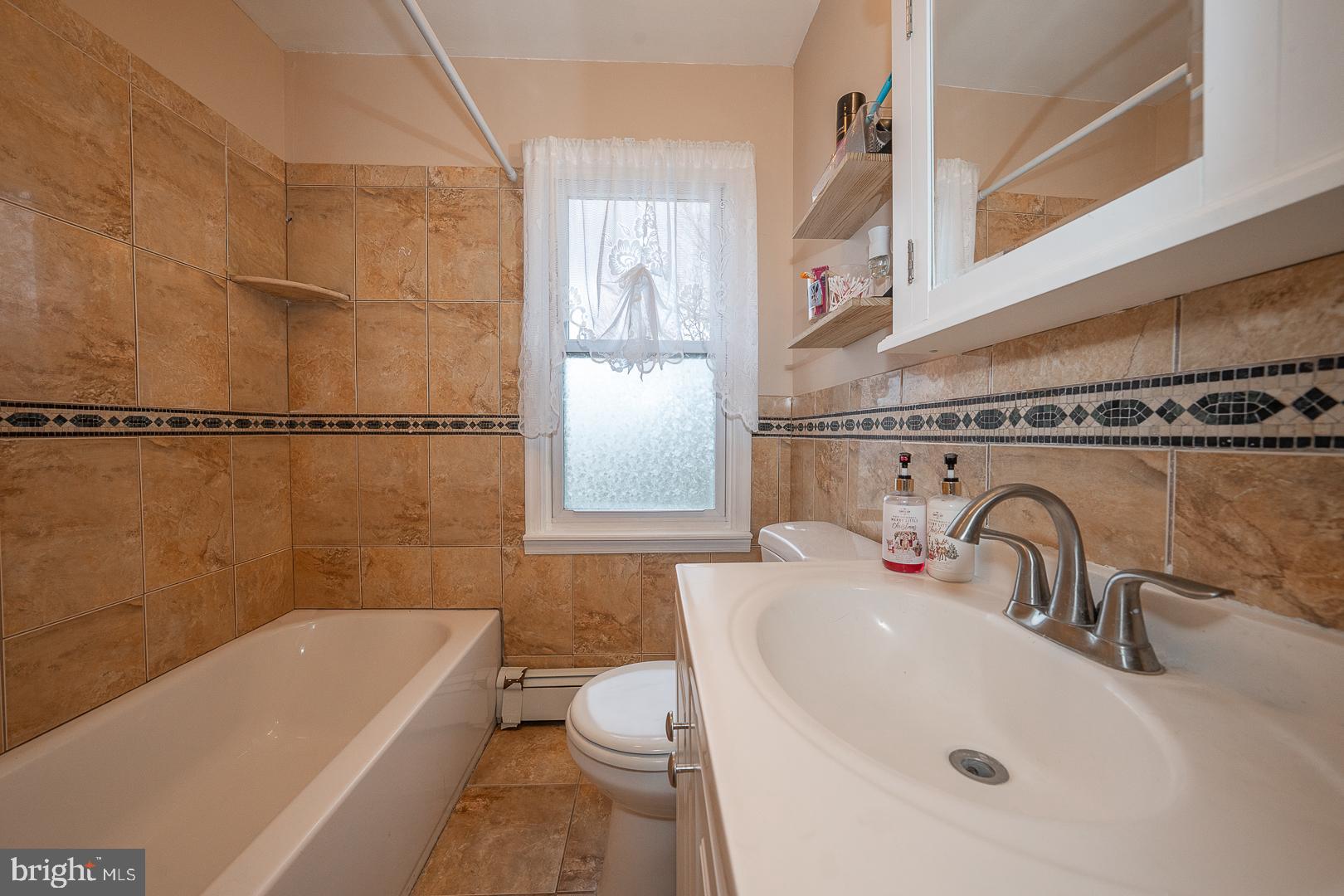 119 Wilson Avenue Havertown, PA 19083 - Photo 19 of 31 a bathroom with a sink a toilet and bathtub