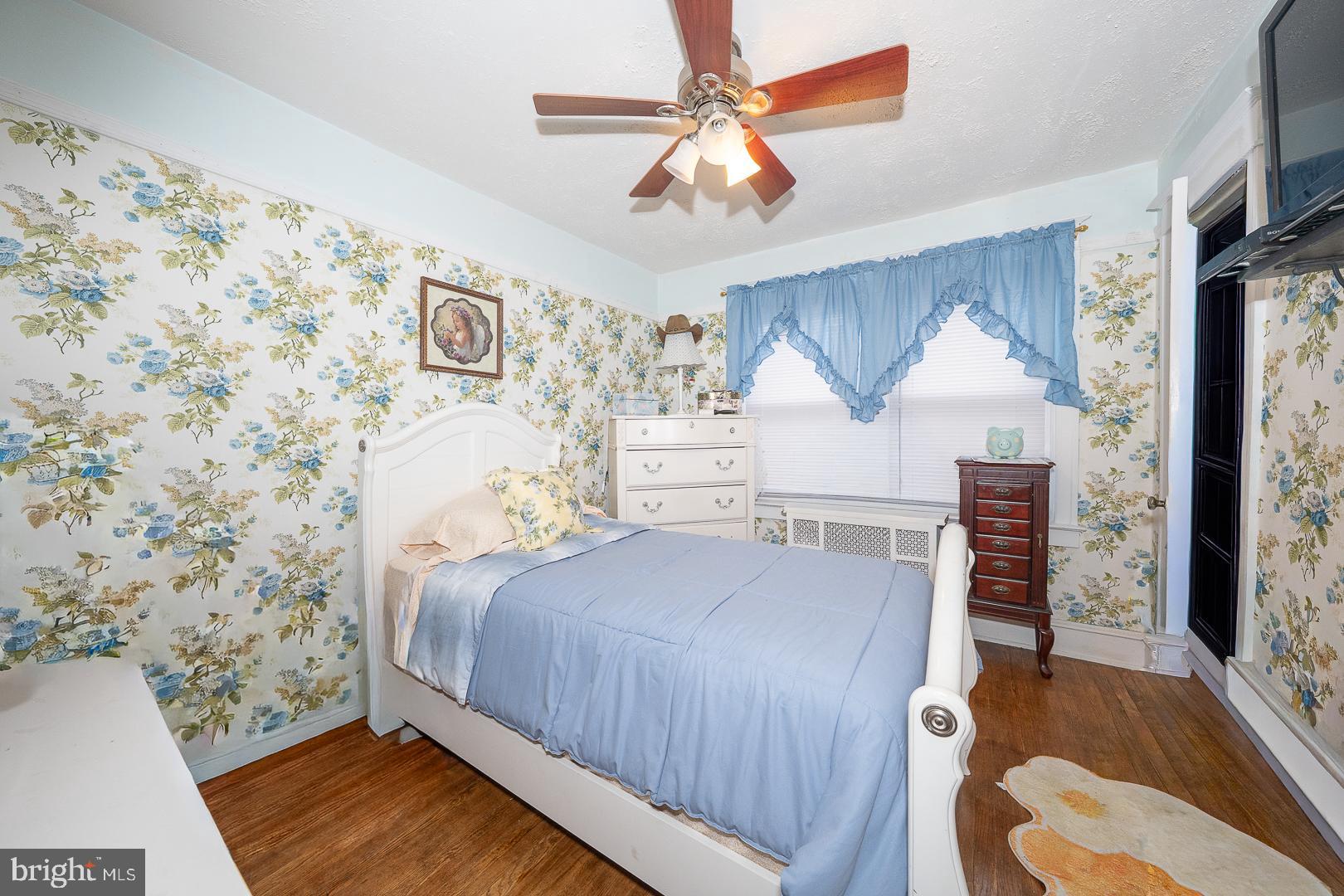 119 Wilson Avenue Havertown, PA 19083 - Photo 21 of 31 a bedroom with a bed and a painting on the wall