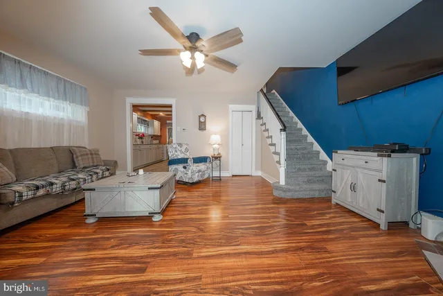 a view of a livingroom with furniture and a fireplace
