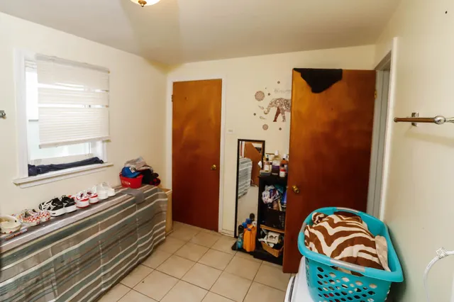 a bathroom with a toilet and shower curtain