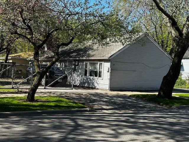 a house that has a tree in front of it