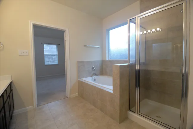 a bathroom with a bathtub and a shower