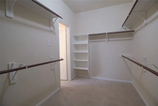 a view of an empty walk in closet