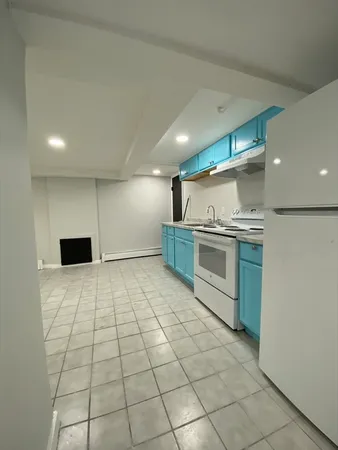 a kitchen with stainless steel appliances a refrigerator and cabinets