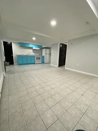 a bathroom with a toilet sink vanity and mirror