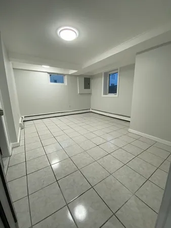a view of an empty room and cabinet