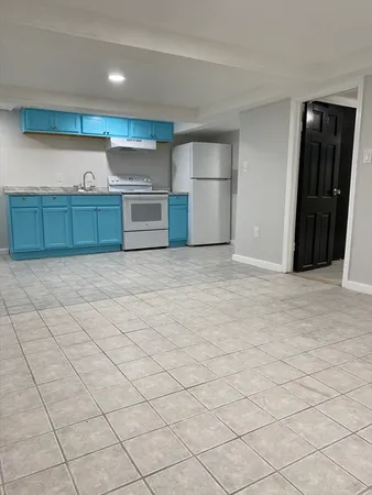 a kitchen with stainless steel appliances a refrigerator and a stove top oven