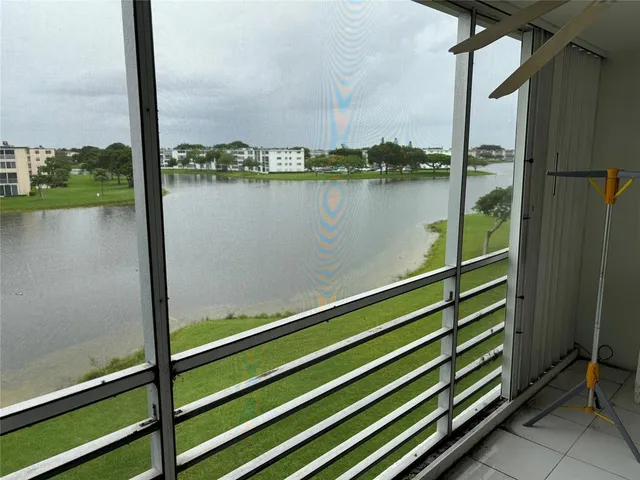 a view of outdoor space with lake view and living room