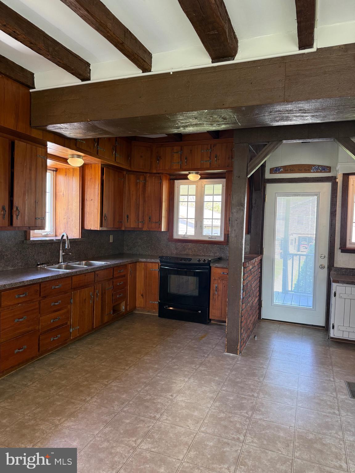 4056 East Newport Road Kinzers, PA 17535 - Photo 15 of 20 a kitchen with granite countertop a sink and cabinets