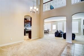 2723 Intrepid Trail Rosenberg, TX 77471 - Photo 6 of 30 Just past the study is an elegant formal dining room with a soaring 2-story ceiling and direct access to both the family room and kitchen; it's an entertainer's dream!