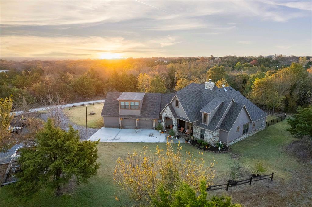 a view of a house with pool and a yard