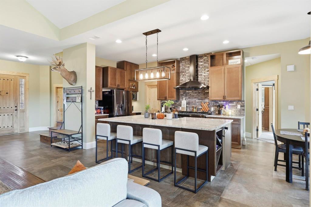3300 Rigsby Lane Celina, TX 75009 - Photo 13 of 40 a large kitchen with a table and chairs