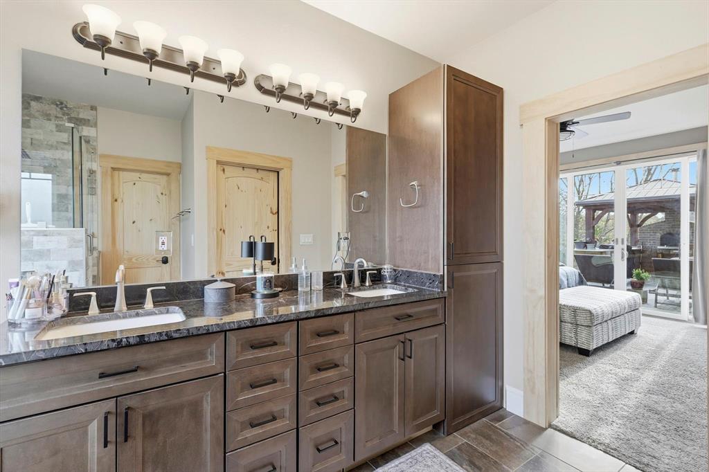 3300 Rigsby Lane Celina, TX 75009 - Photo 23 of 40 a spacious bathroom with double vanity sinks a mirror and a shower