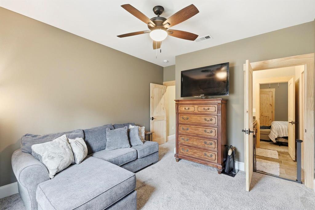 3300 Rigsby Lane Celina, TX 75009 - Photo 27 of 40 a living room with furniture and a flat screen tv