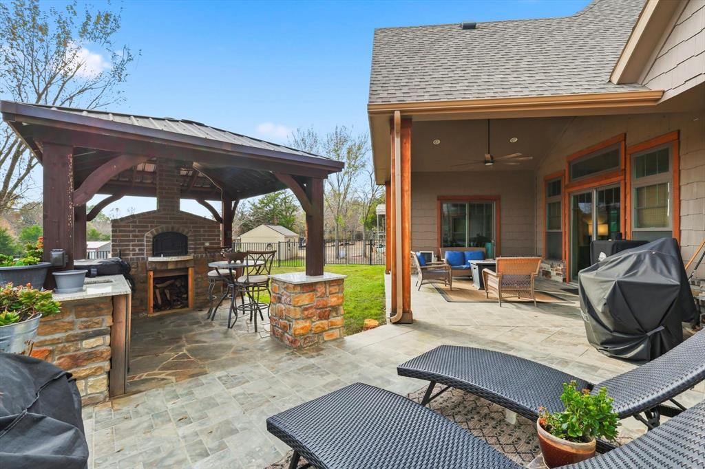 3300 Rigsby Lane Celina, TX 75009 - Photo 38 of 40 a view of a patio with dining table and chairs with a barbeque grill and couches